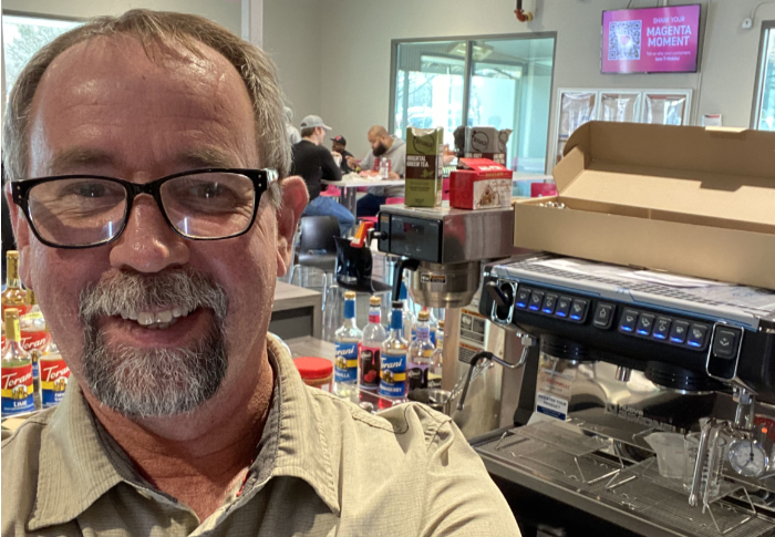 Steven Rook, owner of Pacific Beverage Service, with a commercial espresso machine